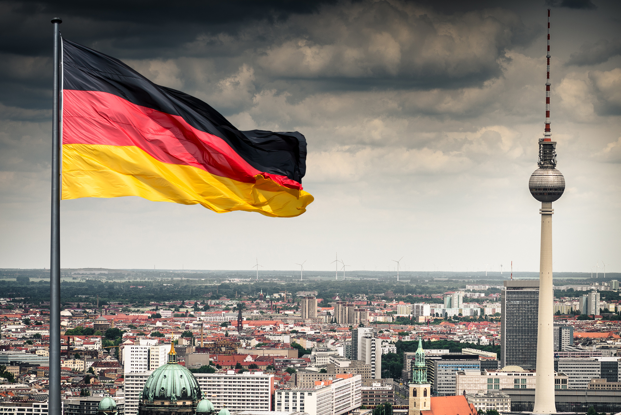 Flag of Germany over Berlin skyline