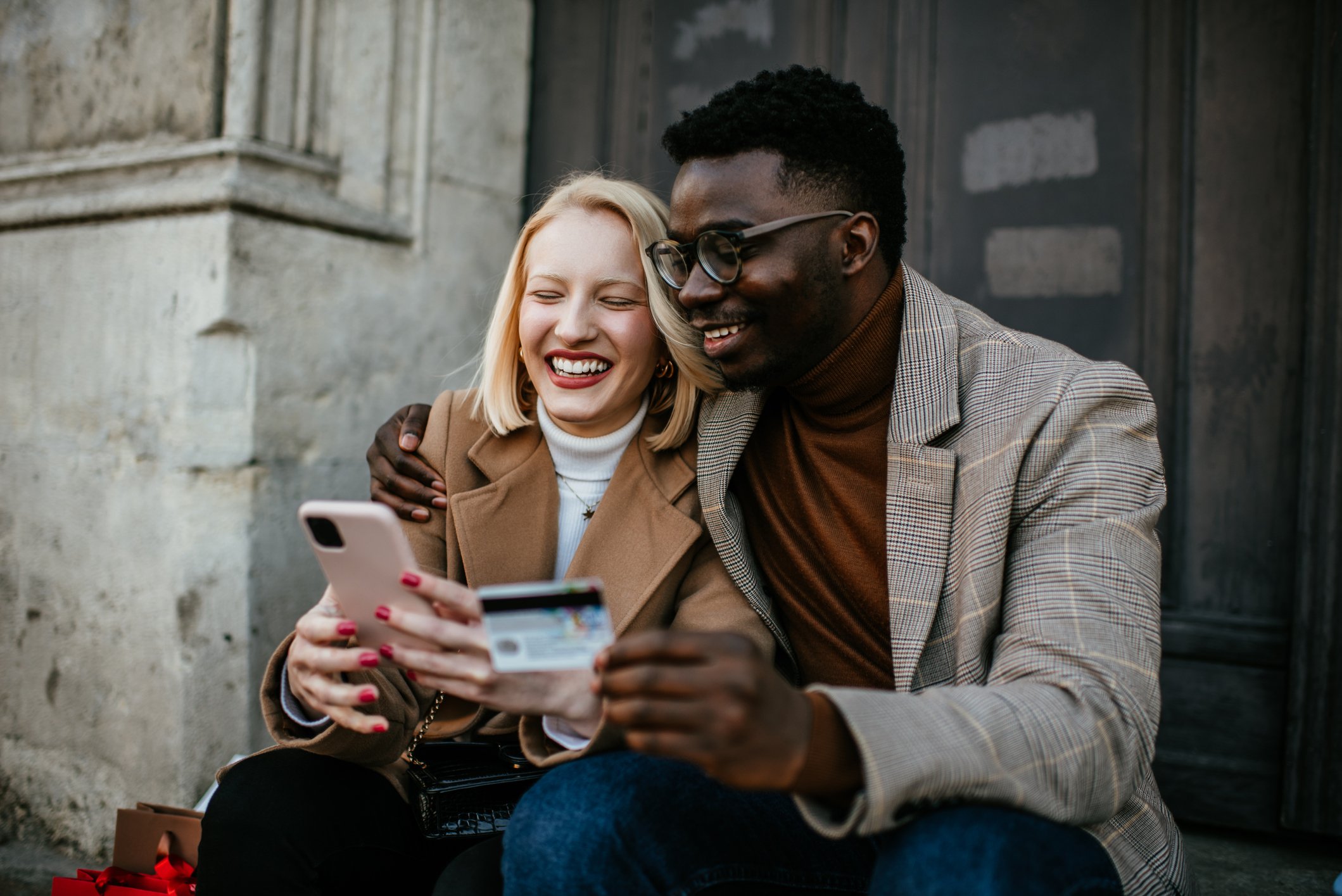 Two people online shopping on phone