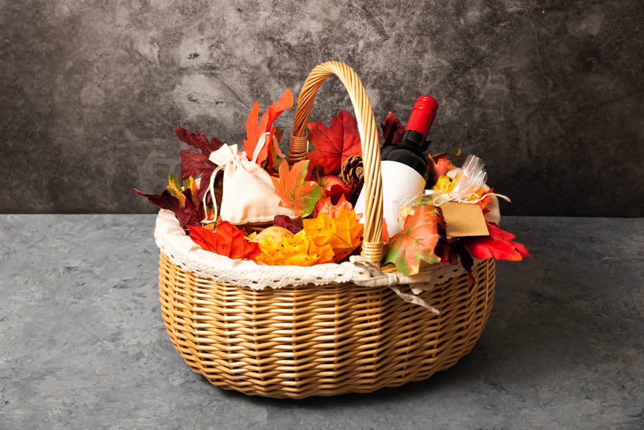 A autumnal hamper with wine and leaves