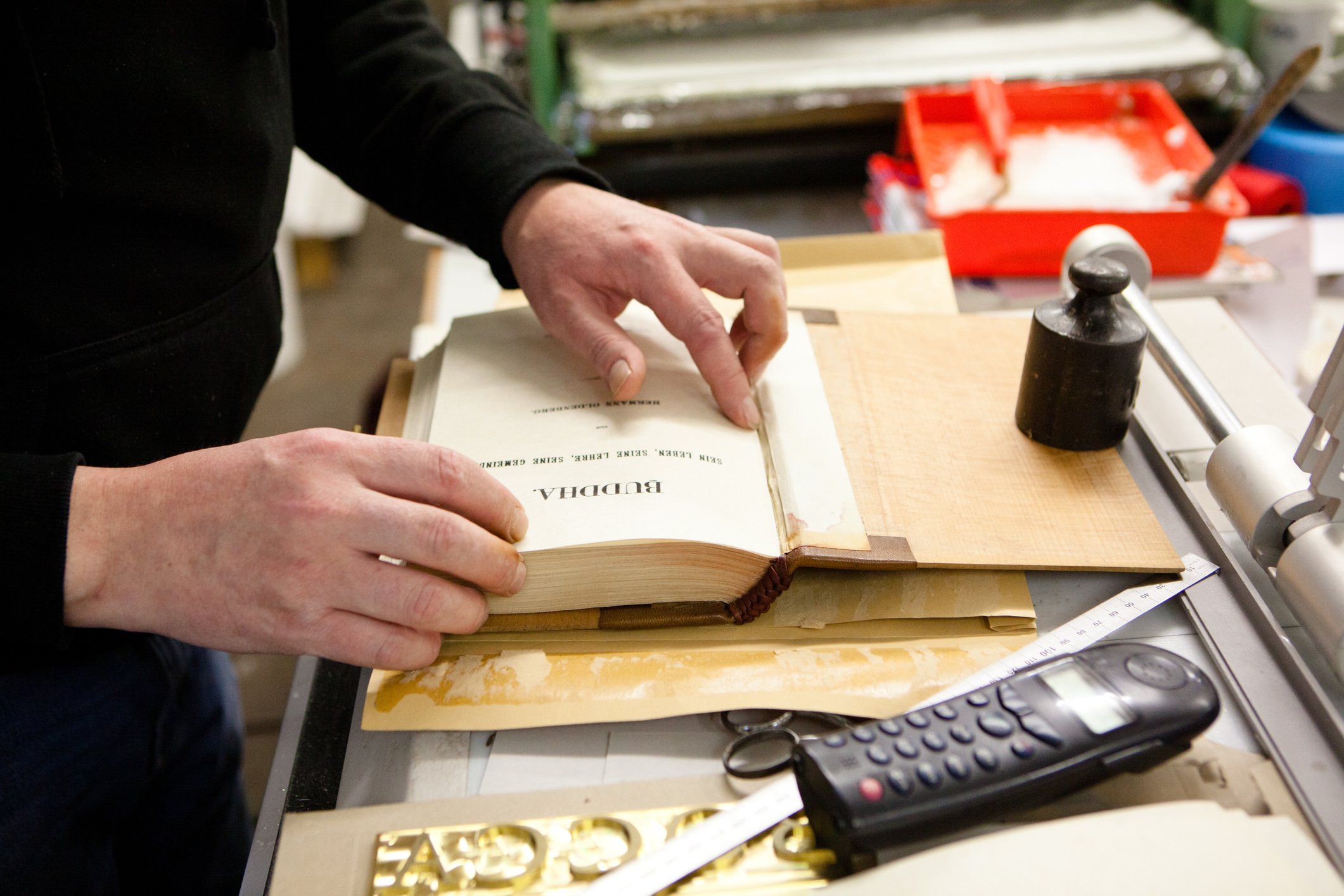 Man binding book