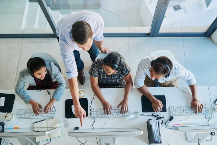 overview-shot-of-people-using-computer-at-work