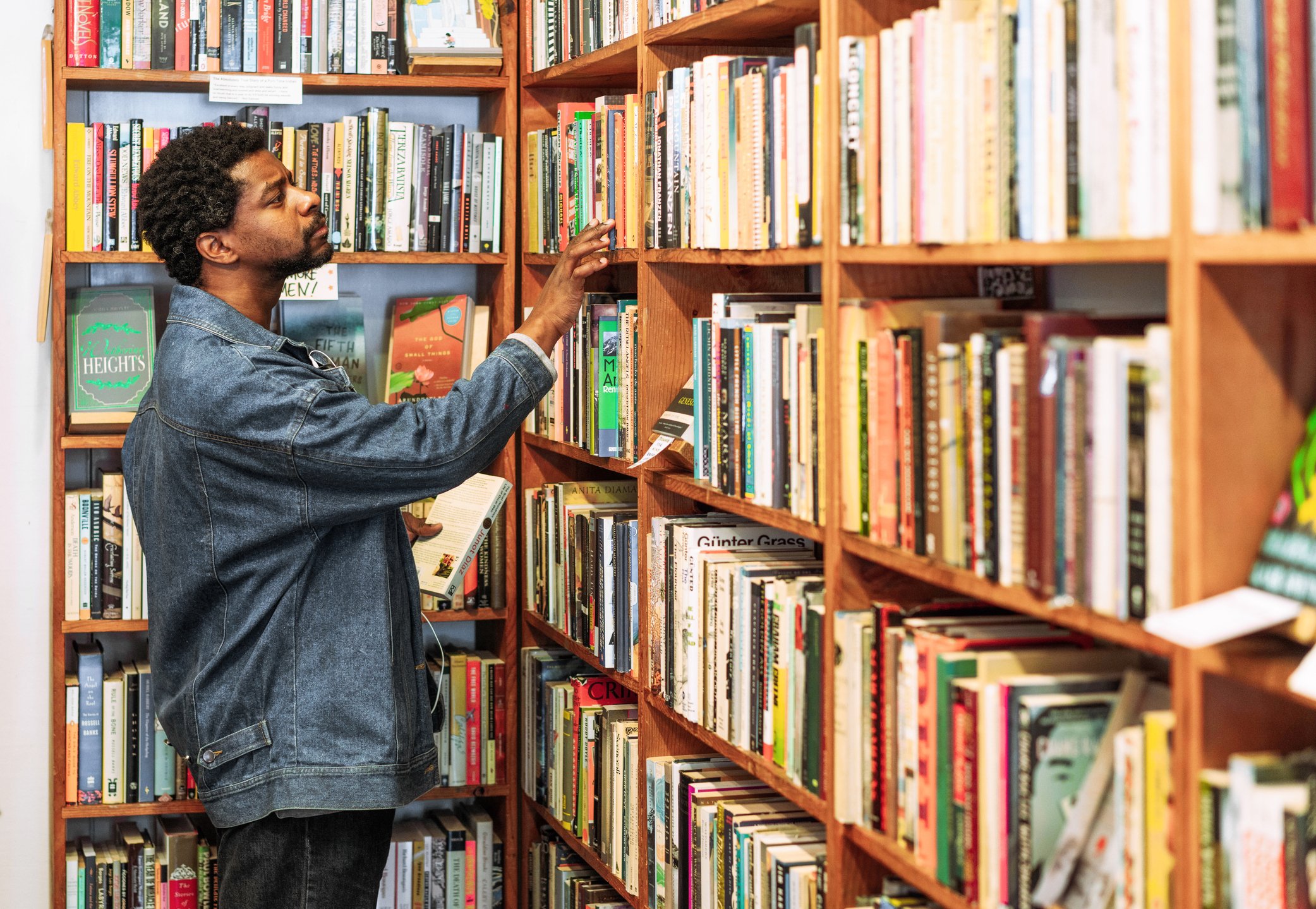 Man browsing books in bookshop