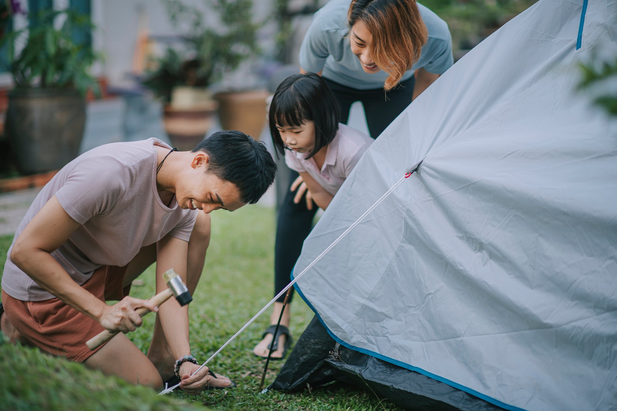Family putting up tent