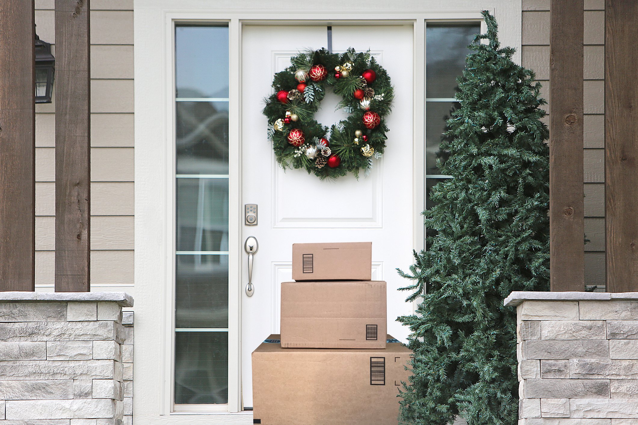 parcels in front of door with christmas decoration