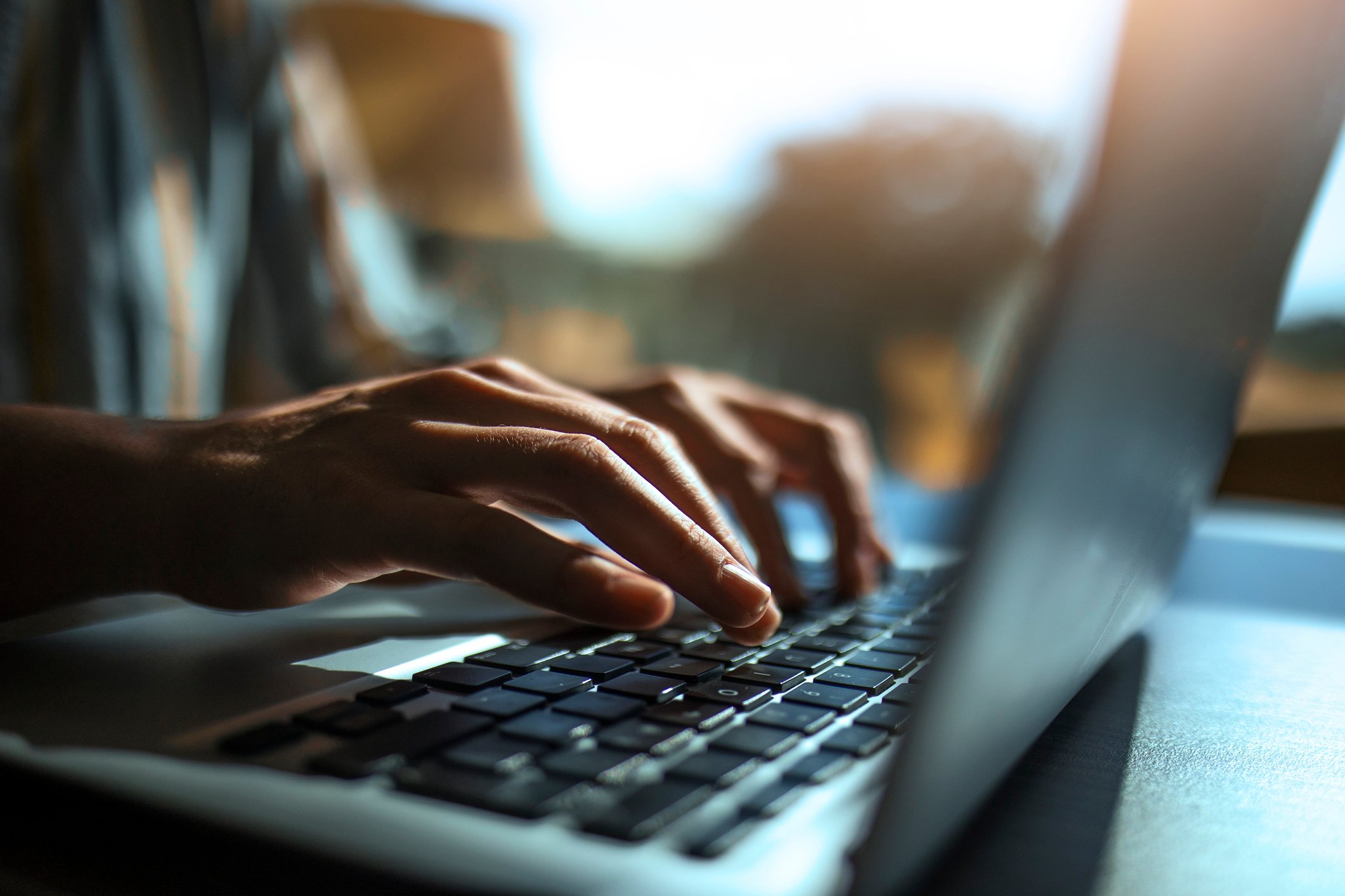 close up of person using laptop