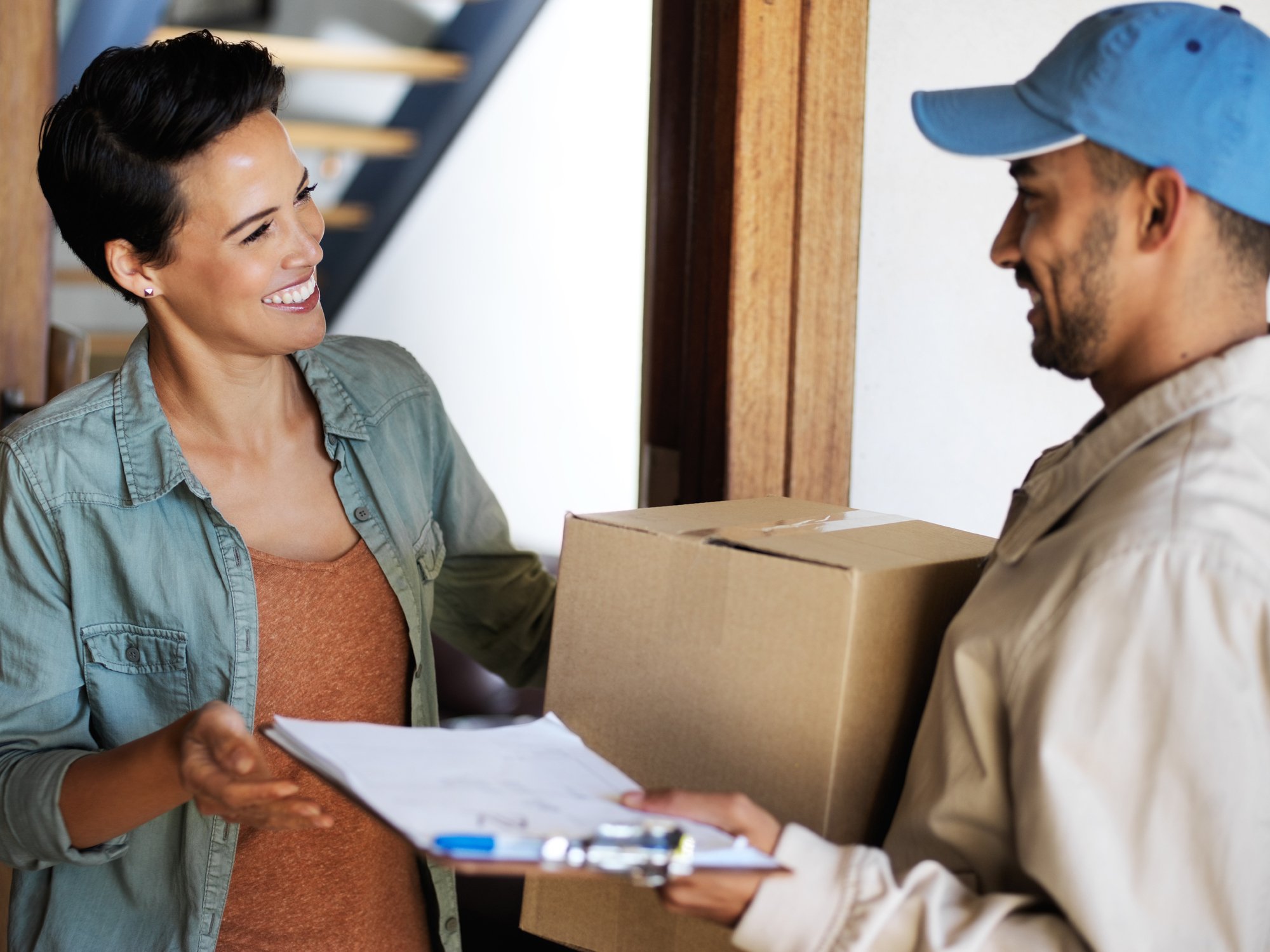 delivery-man-handing-parcel-to-woman