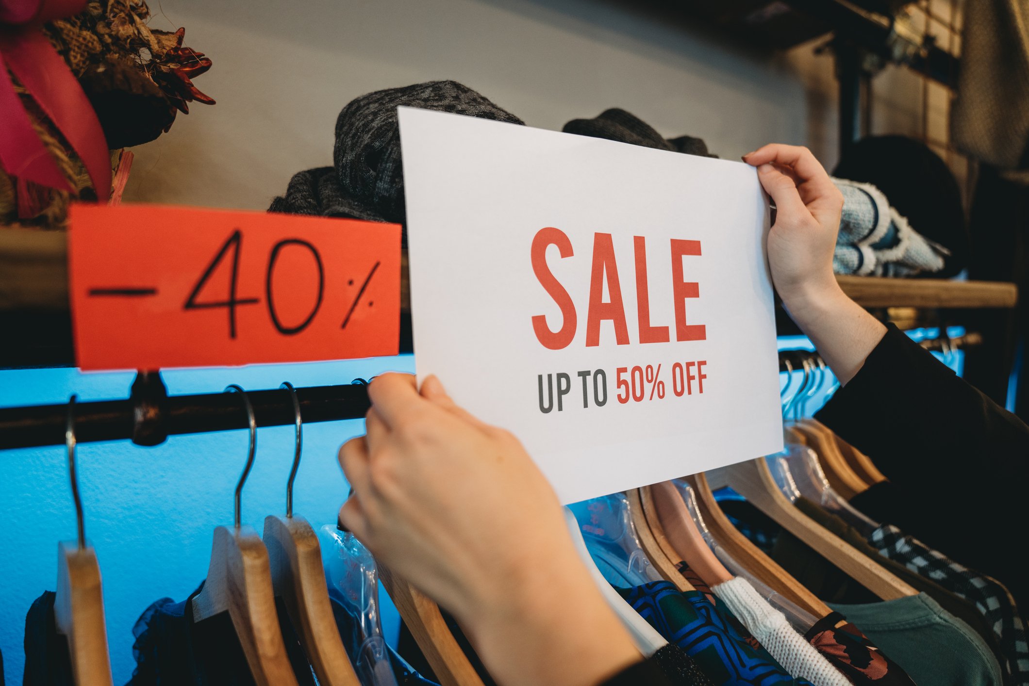Clothes rail with discount sign