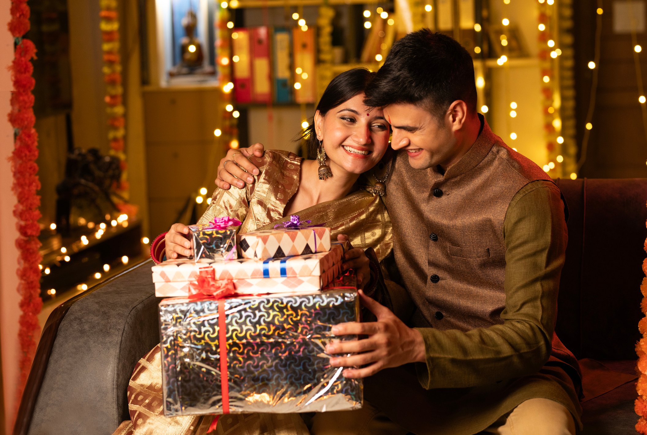 couple opening gift for diwali