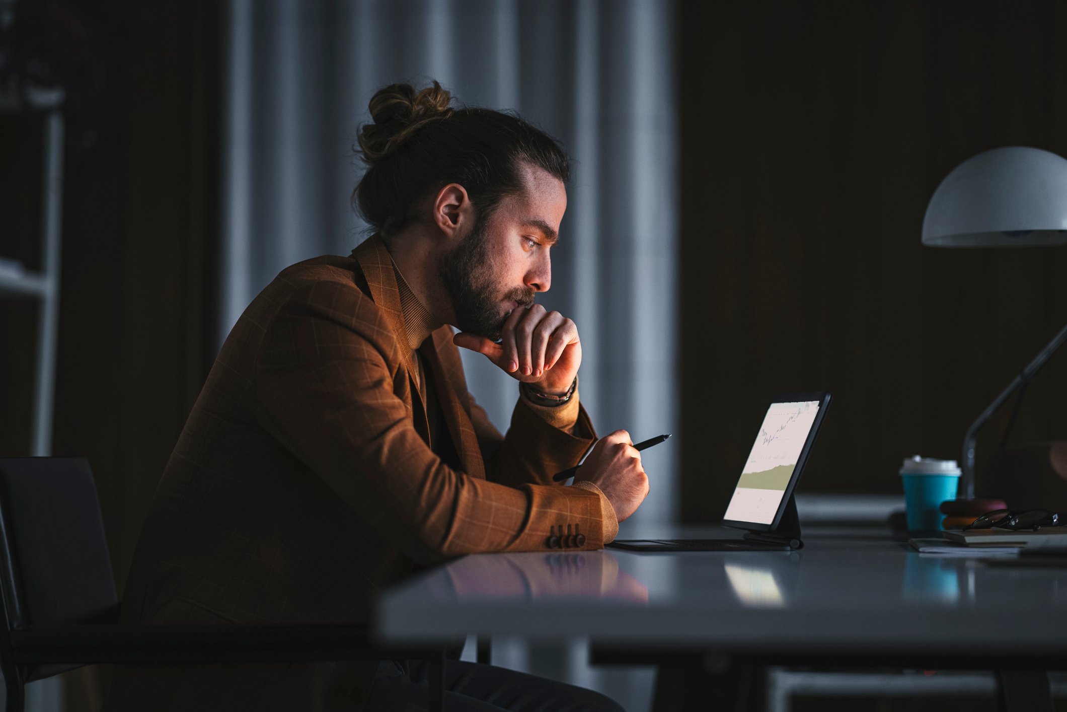 person focused looking at laptop