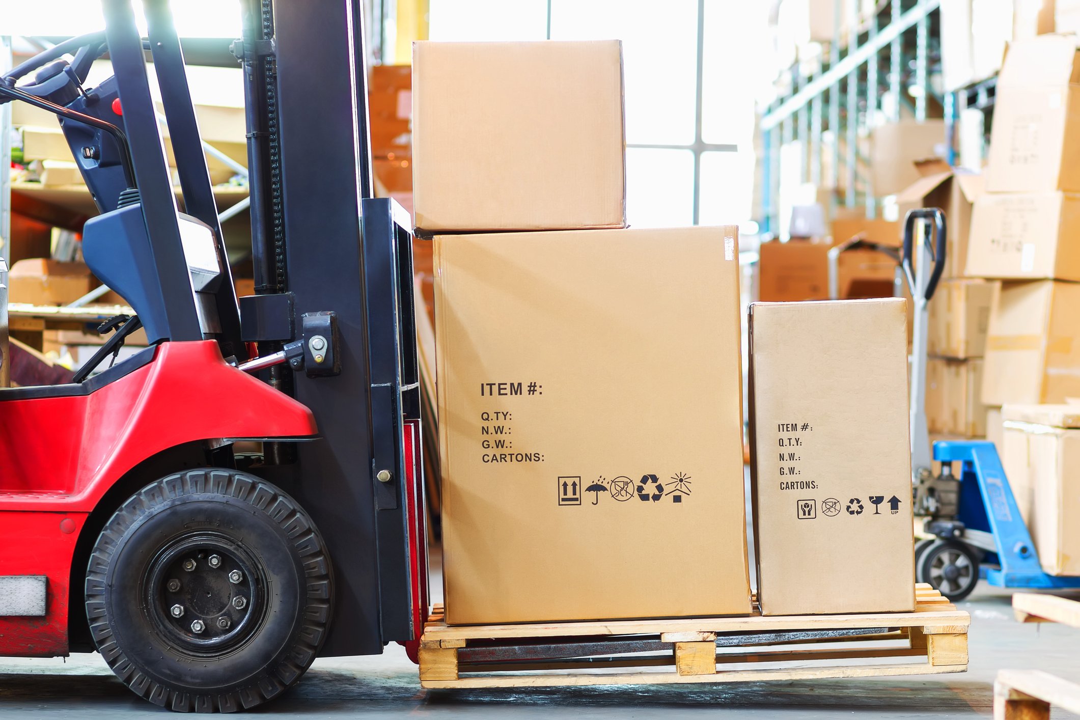 forklift carrying multiple large parcels