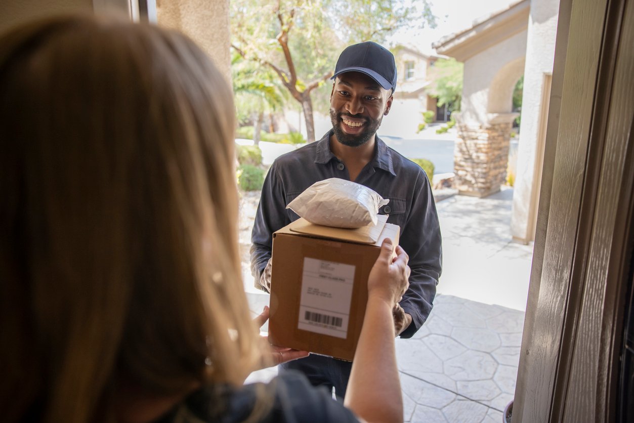 handing a parcel to courier