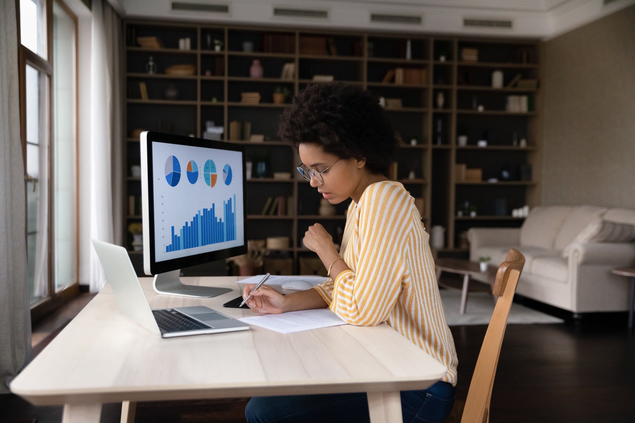 Woman with pie charts on computer