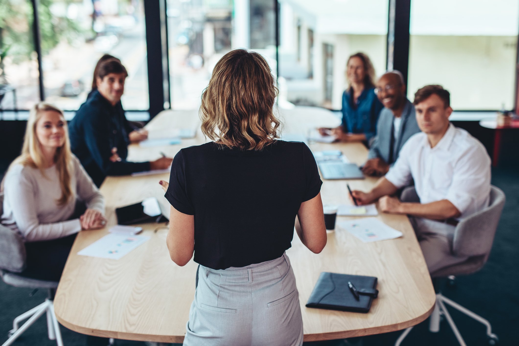 Manager at head of work table