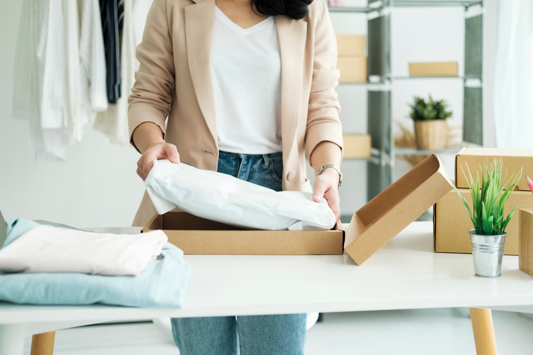 packing parcel with clothes at home