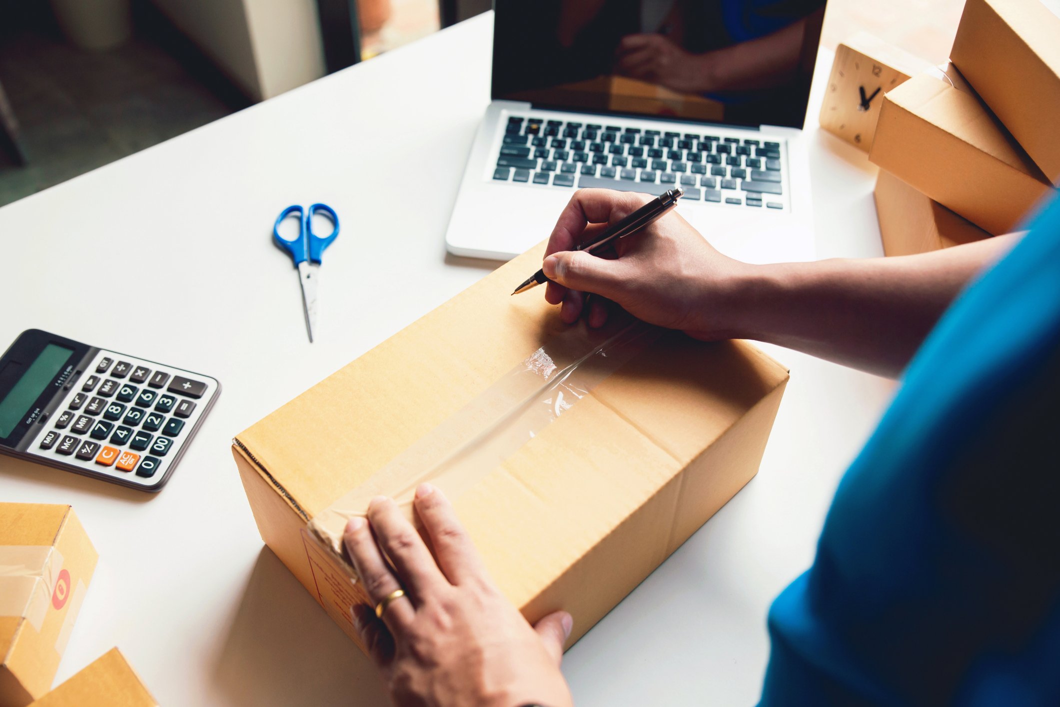 person packing parcel