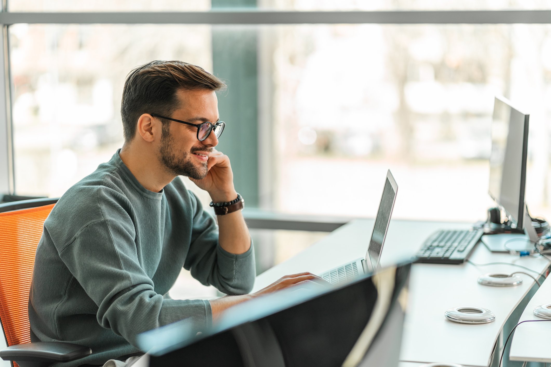 person using laptop and smiling