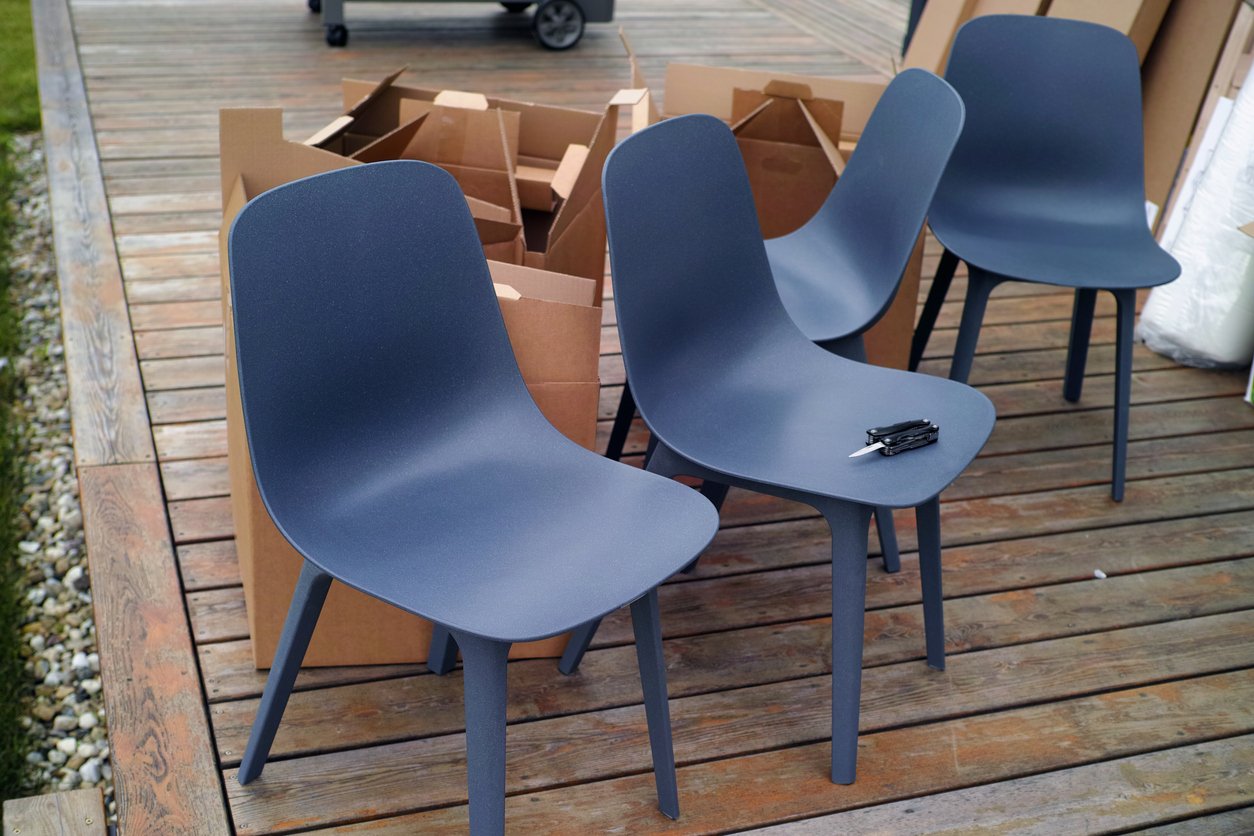 Plastic chairs and boxes in garden