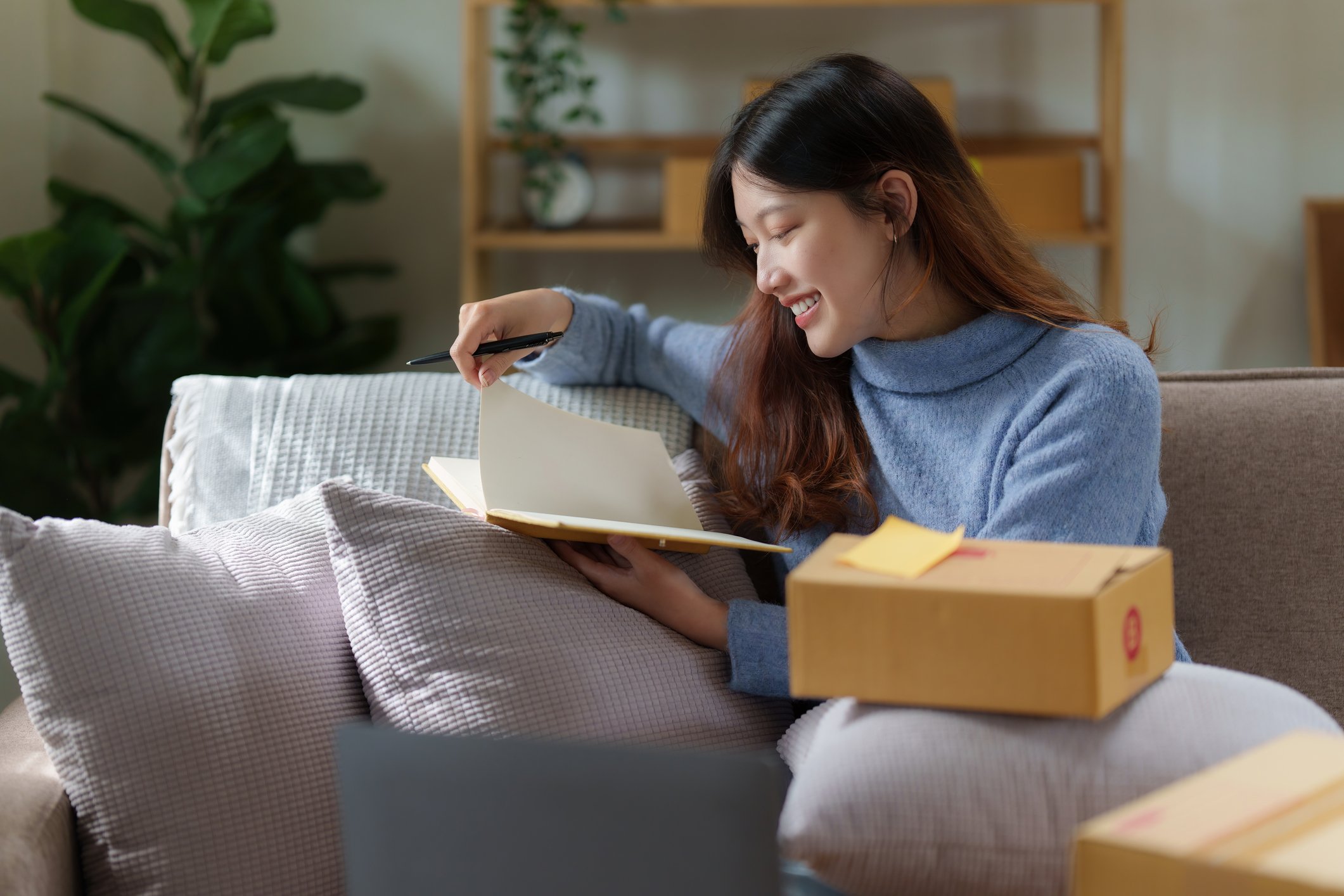 person reading books opened from parcel