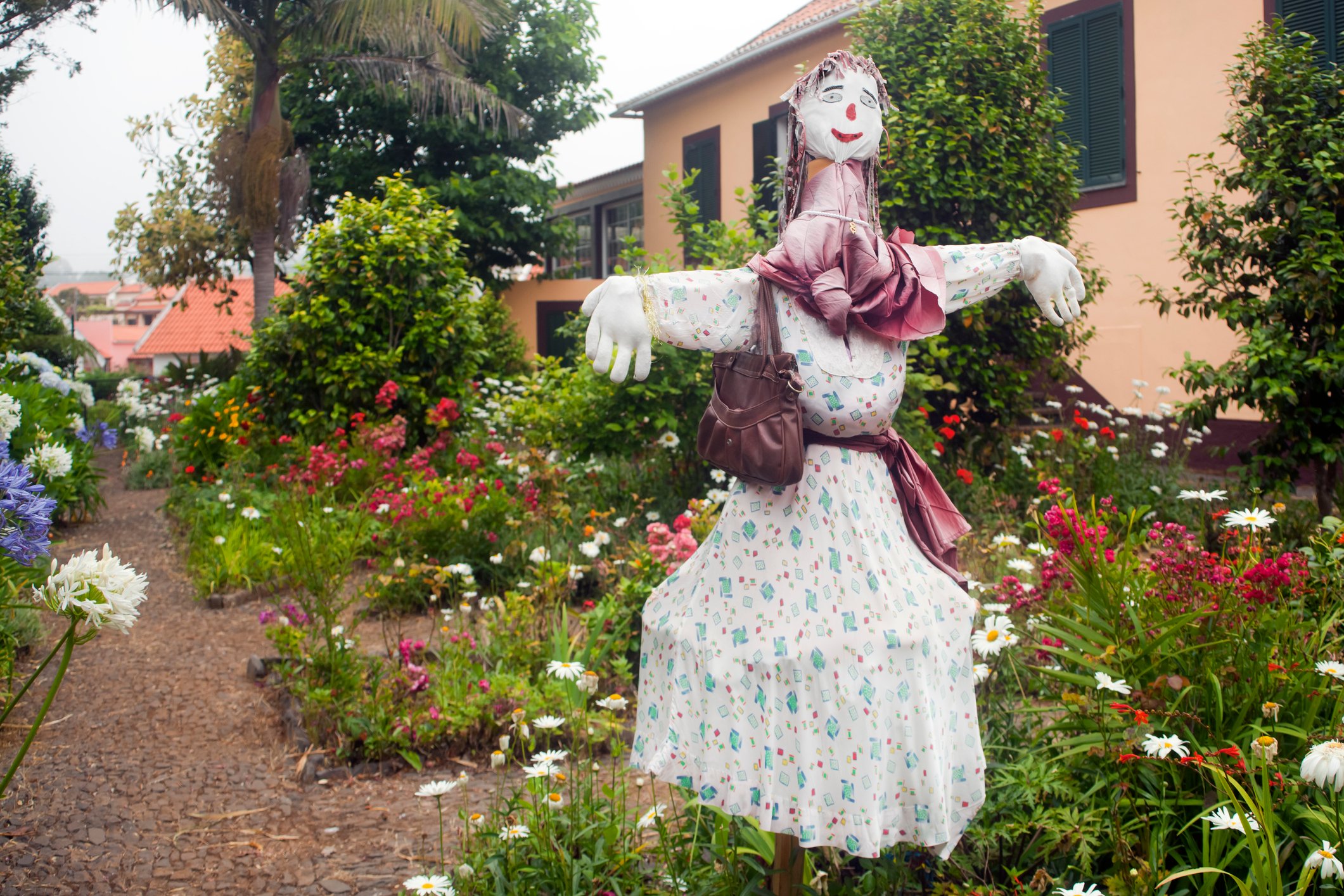 Happy scarecrow in garden