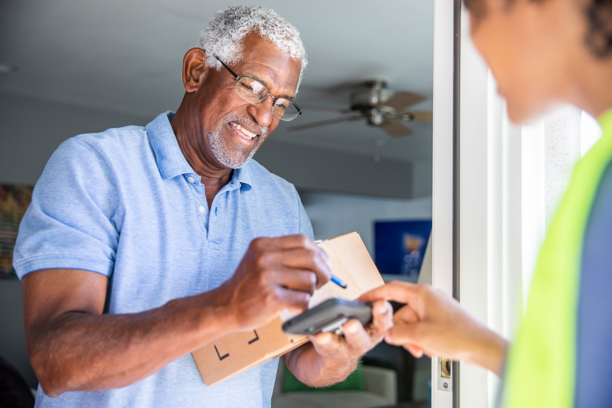 Smiling man receiving delivery