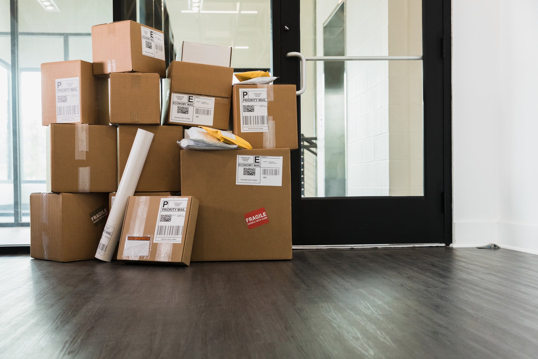 stack-of-parcels-in-front-of-door