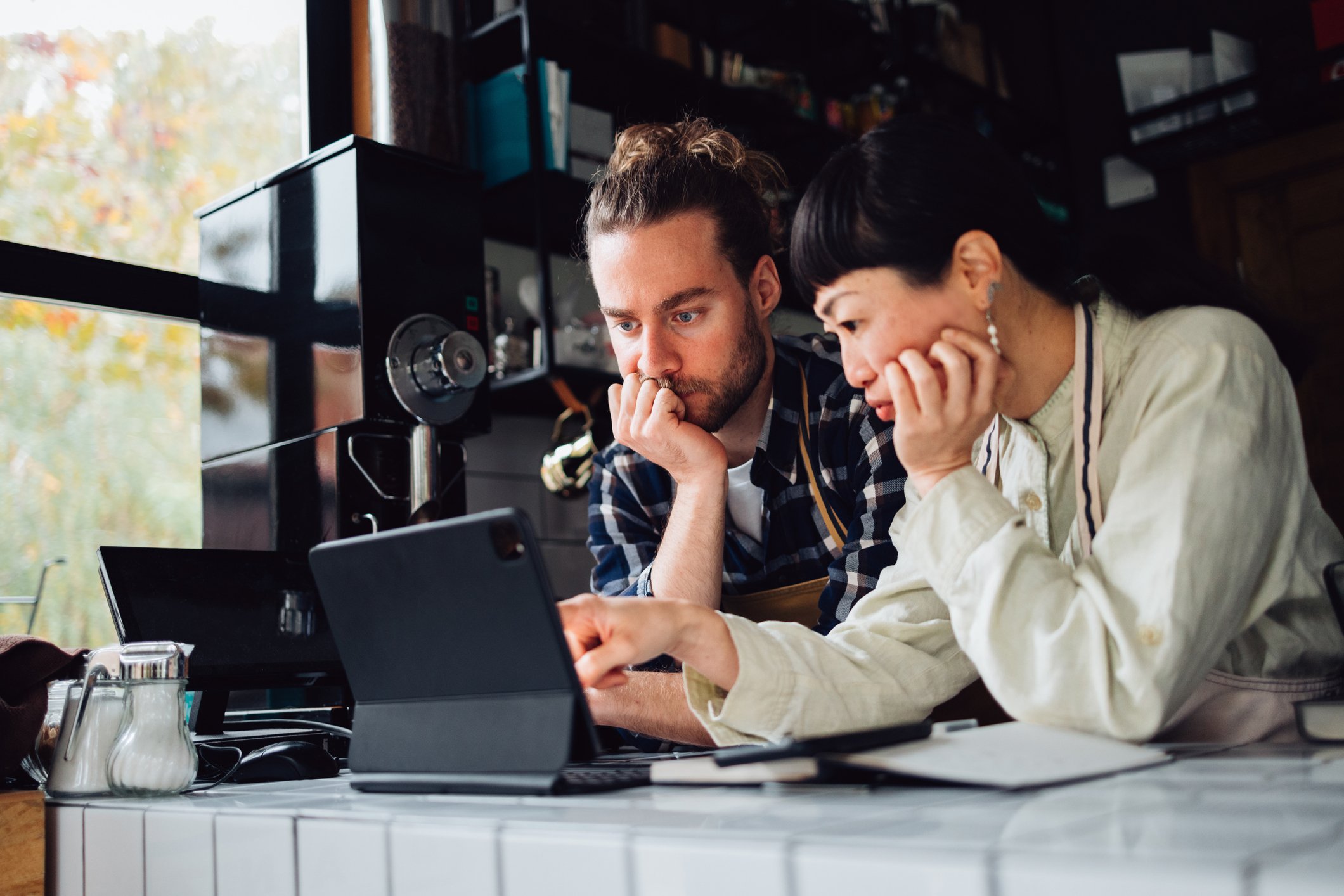 two people looking at laptop