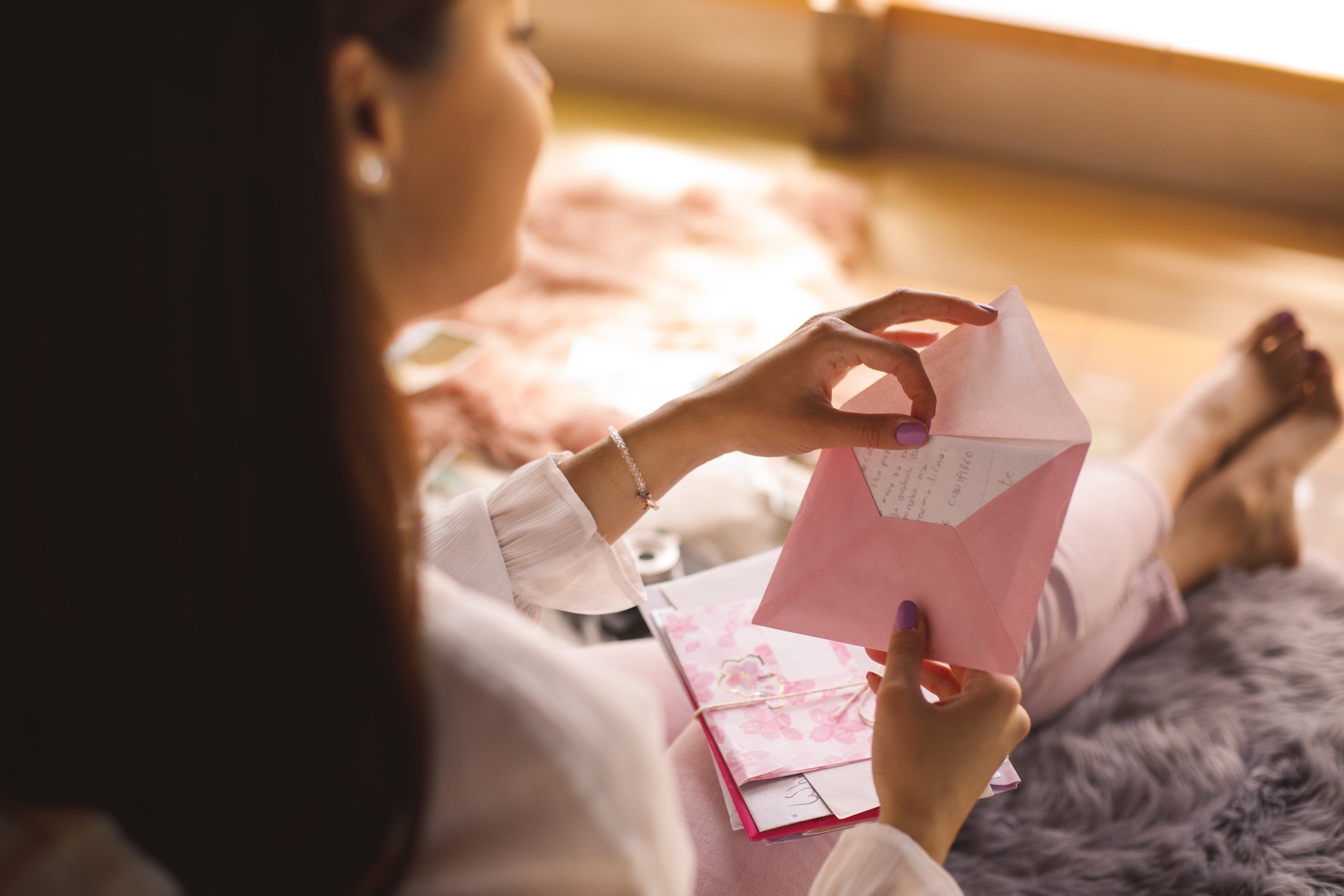 woman opening greeting card