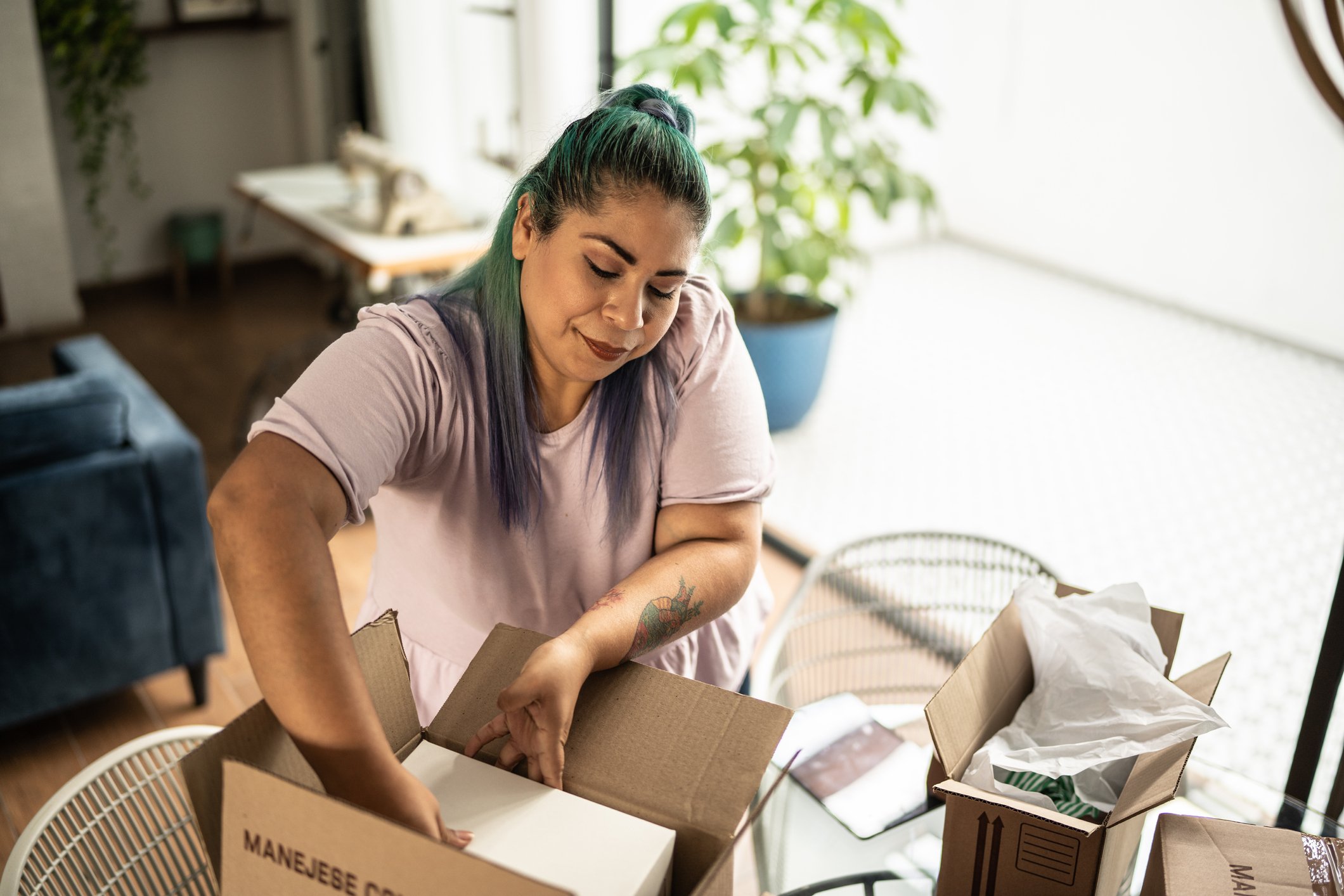 Woman packing parcel