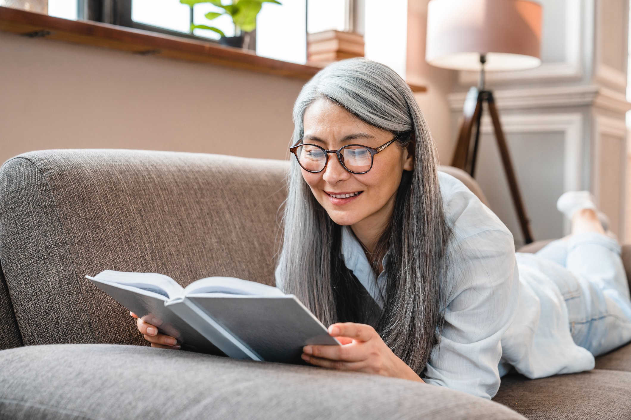 Woman smiling as she reads