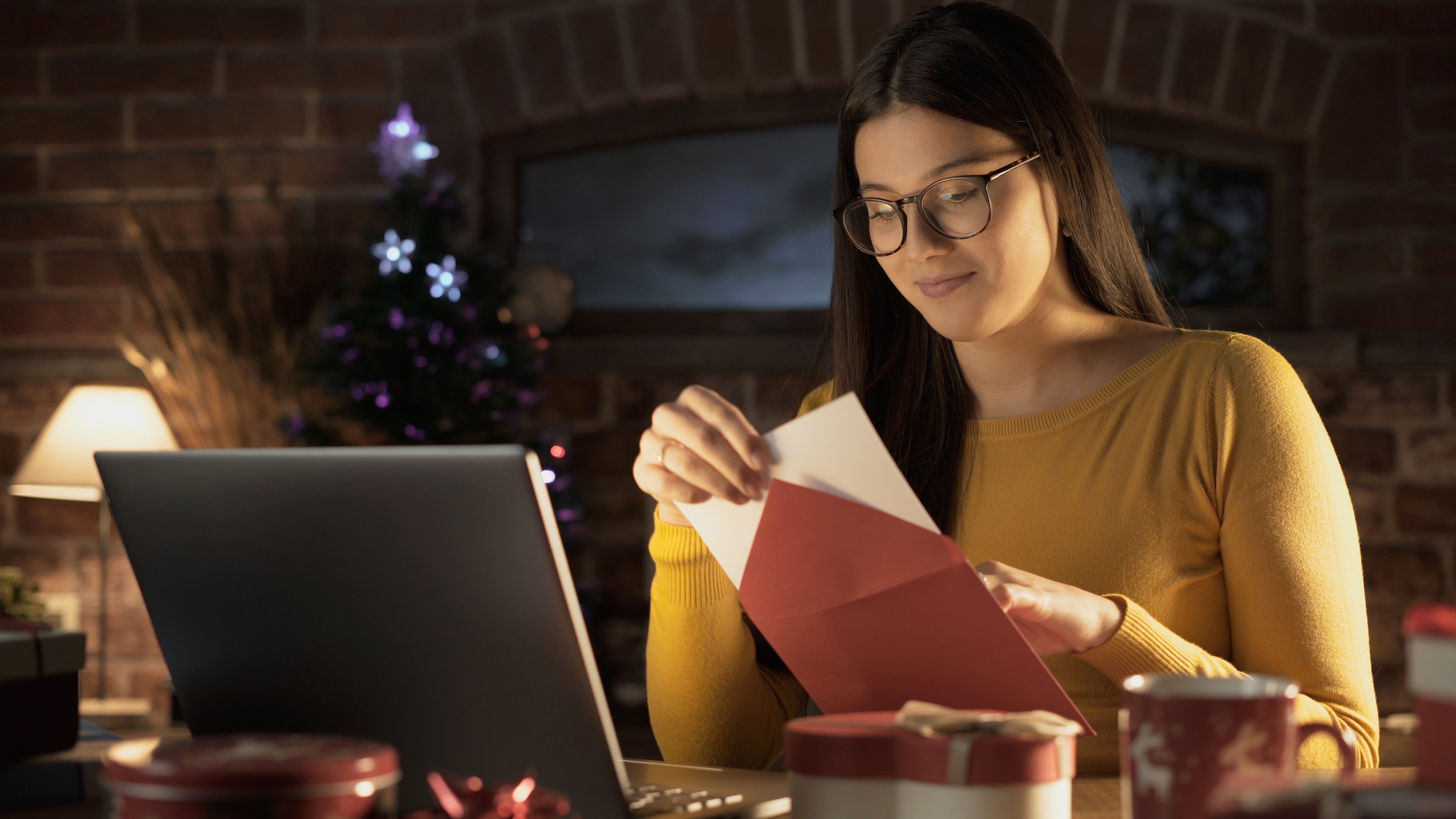 woman-sealing-christmas-card