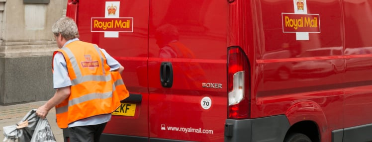 Royal Mail driver outside his van